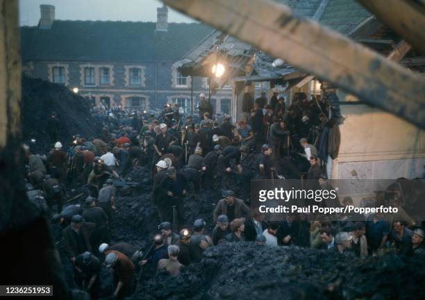 Local men and rescue workers digging through the mud in the village of Aberfan following a landslide from a nearby spoil tip which killed 116...