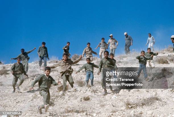 Young Fatah Guerilla recruits undergoing commando training at a desert camp near the Israeli border in Jordan, circa 1968. The Fatah movement joined...