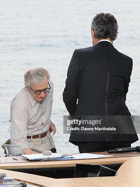 Woody Allen fall over into TV presenter Michel Denisot as he walks on stage for the Chanel+ program 'Le Grand Journal' at Majestic Beach Pier on May...