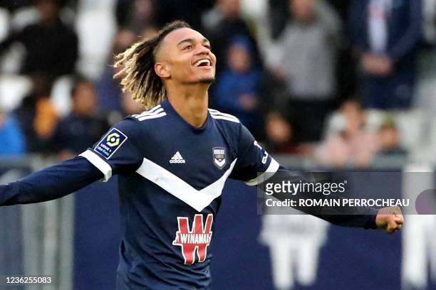 Bordeaux' French forward Sekou Mara celebrate the victory after the French L1 football match between FC Girondins de Bordeaux and Stade de Reims at...