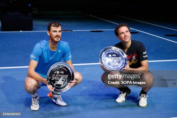 Jamie Murray of Great Britain and Bruno Soares of Brazil pose with their awards during the award ceremony for the winners of the final doubles match...