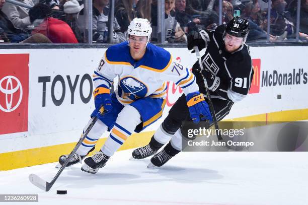 Jacob Bryson of the Buffalo Sabres and Carl Grundstrom of the Los Angeles Kings battle for position during the first period at STAPLES Center on...