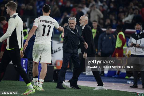 Milan's Swedish forward Zlatan Ibrahimovic and Roma's Portuguese head coach Jose Mourinho shake hands as AC Milan's Italian head coach Stefano Pioli...