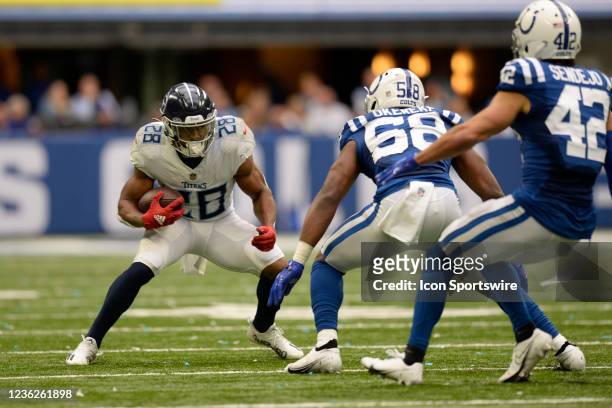 Tennessee Titans Running Back Derrick Henry attempts to juke Indianapolis Colts Linebacker Bobby Okereke and Indianapolis Colts Safety Andrew Sendejo...