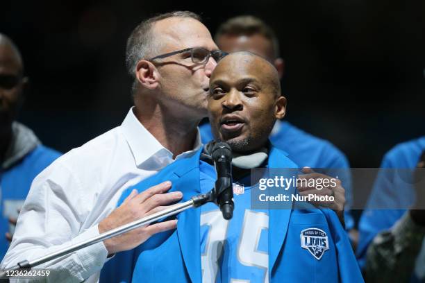 William Eugene White former Detroit Lions player speaks standing with Chris Spielman during the Pride of the Lions celebration during halftime of an...