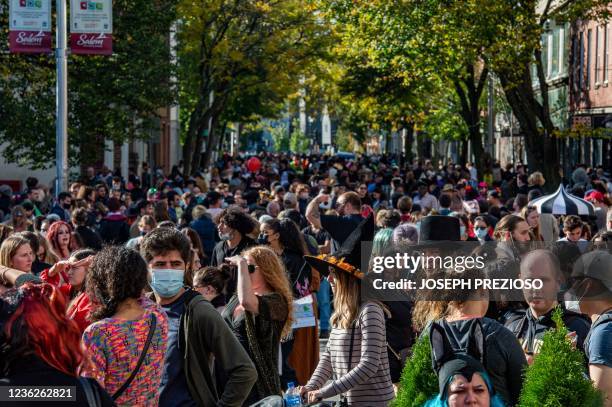 People fill the streets on Halloween in Salem, Massachusetts on October 31, 2021. - The city is the location of the witch trials that took place in...
