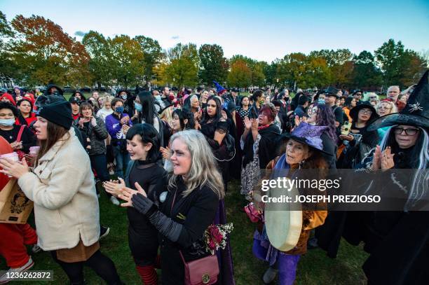 Modern day witches and other participants march around the inner circle and chant during the Witches' Magic Circle in the common on Halloween in...