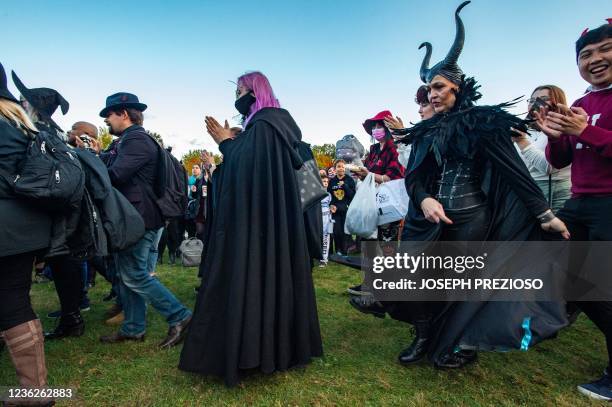 Modern day witches and other participants march around the inner circle and chant during the Witches' Magic Circle in the common on Halloween in...