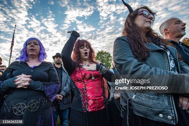 Witches call out of the names of lost loved ones during the Witches' Magic Circle in the common on Halloween in Salem, Massachusetts on October 31,...