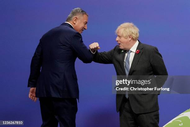 British Prime Minister Boris Johnson greets Montenegro President Milo Dukanovic as they arrive for day two of COP26 at SECC on November 1, 2021 in...