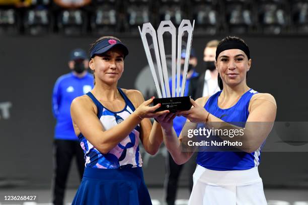 Portraits of Ekaterine Gorgodze and Irina Bara holding the trophy after winning the doubles final match of Transylvania Open Irina Bara and Ekaterine...