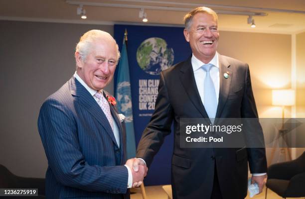 Prince Charles, Prince of Wales greets the President of Romania Klaus Iohannis ahead of their bilateral meeting during the Cop26 summit at the...