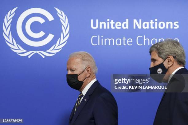 President Joe Biden , flanked by U.S. Climate Adviser John Kerry, arrives to attend a meeting focused on action and solidarity at the UN Climate...