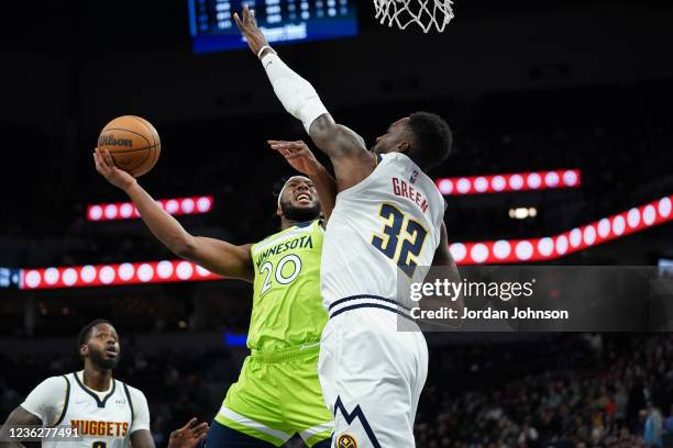 Josh Okogie of the Minnesota Timberwolves drives to the basket against the Denver Nuggets on OCTOBER 30, 2021 at Target Center in Minneapolis,...