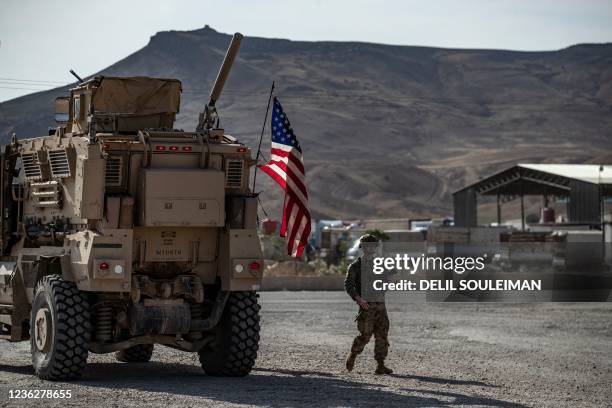 Soldiers patrol an area near Syria's northeastern Semalka border crossing with Iraq's Kurdish autonomous territory, on November 1, 2021.