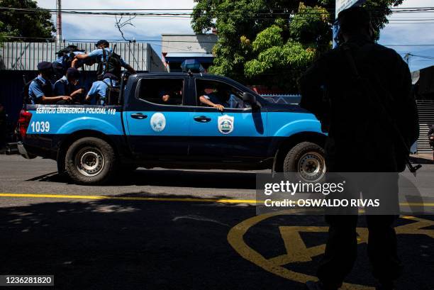 Members of special police troops and Nicaragua's army guard ballot boxes at a distribution centre of the Supreme Electoral Council in Managua, on...