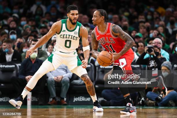 DeMar DeRozan of the Chicago Bulls dribbles while guarded by Jayson Tatum of the Boston Celtics at TD Garden on November 1, 2021 in Boston,...