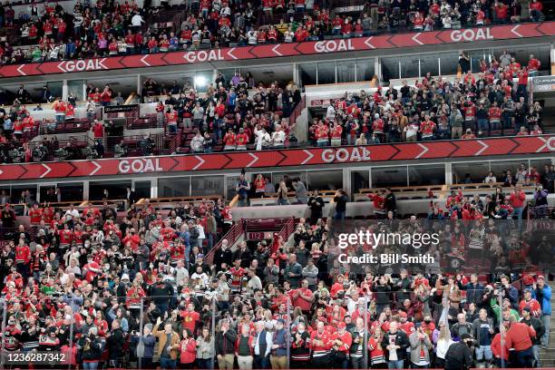 Fans cheer after the Chicago Blackhawks scored against the Ottawa Senators in the third period at United Center on November 01, 2021 in Chicago,...