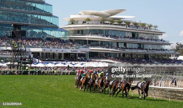 The field on the first lap of the Lexus Melbourne Cup at Flemington Racecourse on November 02, 2021 in Flemington, Australia.
