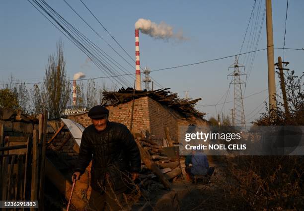 Smoke belches from a coal-powered power station near Datong, China's northern Shanxi province on November 2, 2021.