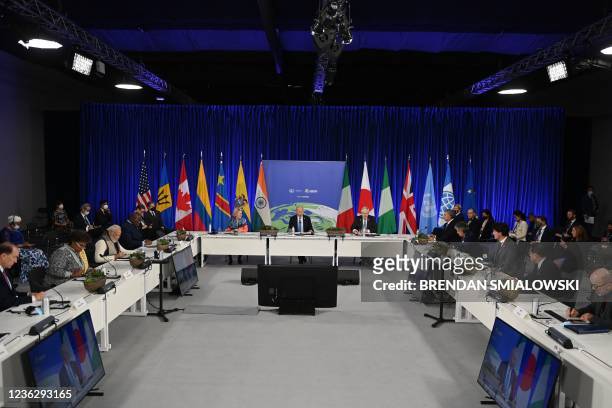President Joe Biden , flanked by President of the European Commission Ursula von der Leyen and British Prime Minister Boris Johnson , speaks during a...