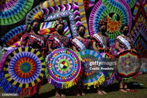 People attend Santiago Sacatepequez Giant Kite Festival within All Saints' Day with art and tradition in Sacatepequez, Guatemala on November 01,...