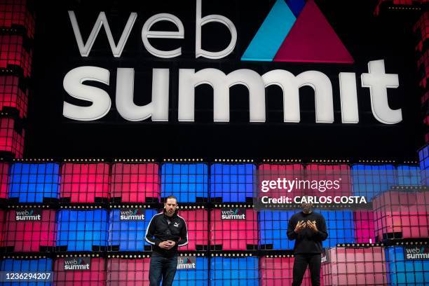 Former French football player Thierry Henry delivers a speech next to PUMA's Global Director of Brand and Marketing Adam Petrick, at the main stage...