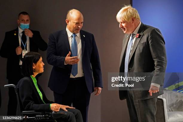 British Prime Minister Boris Johnson is introduced to Israel's Energy Minister Karine Elharrar during a meeting with Israel's Prime Minister Naftali...