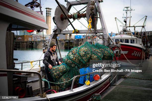 Fisherman unloads a catch of scallops at the harbour in St Helier, Jersey. The UK will not "roll over" in the face of "unreasonable" threats from...