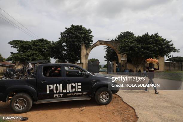 Police truck is stationed outside the University of Abuja Staff Quarters gate where unknown gunmen kidnapped people amongst whom were 2 of the...