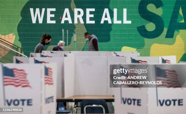 Woman waits to cast her ballot at George Marshall High School, being used as a polling location, on election day in Falls Church, Virginia on...