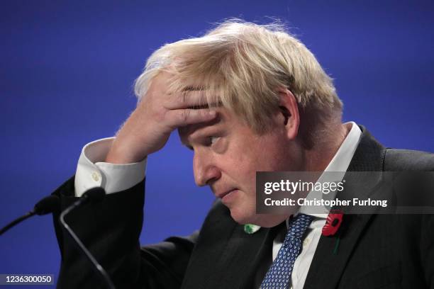 Britain's Prime Minister Boris Johnson speaks during a press conference as the world leaders summit at COP26 comes to a close at SECC on November 2,...