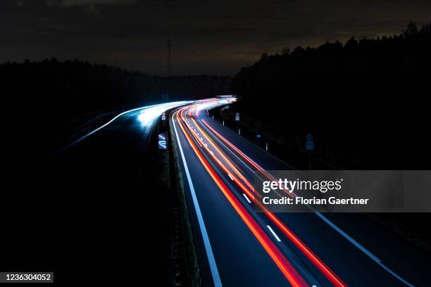 Cars are pictured with long exposure on the highway A13 near Berlin on November 02, 2021 in Staakow, Germany. The region Lusatia in the east of...