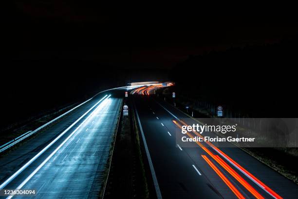 Cars are pictured with long exposure on the highway A13 near Berlin on November 02, 2021 in Staakow, Germany. The region Lusatia in the east of...