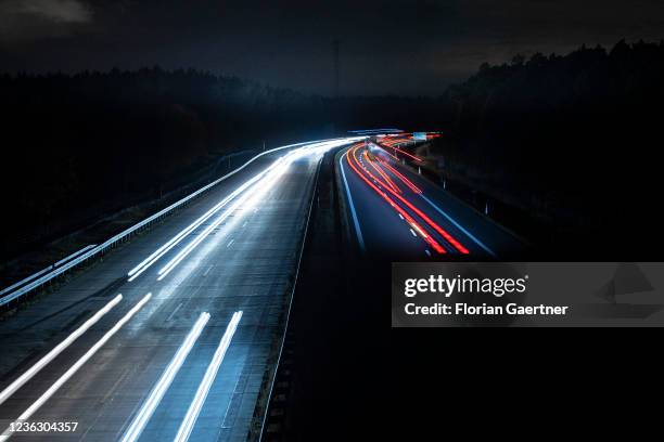 Cars are pictured with long exposure on the highway A13 near Berlin on November 02, 2021 in Staakow, Germany. The region Lusatia in the east of...