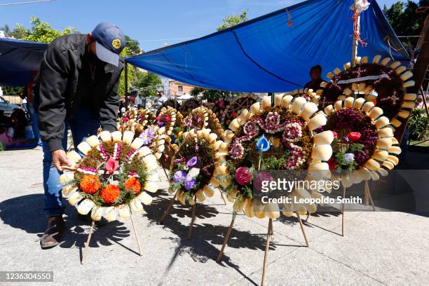 Eulalio Manzano "dead crown" seller poses for a photo in the surroundings of the municipal cemetery on the day of the dead in Guanajuato as part of...