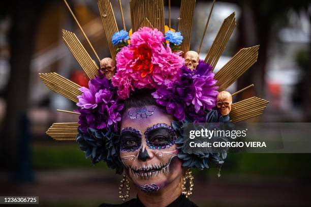 Woman dressed as La Catrina participates in the 12th edition of the annual "Dia de Muertos" parade in Fort Lauderdale, Florida, on November 2, 2021.