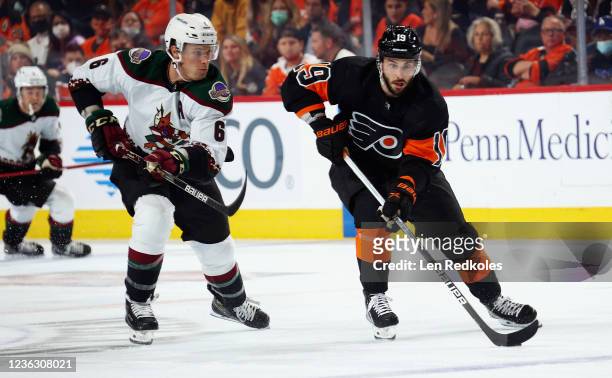 Derick Brassard of the Philadelphia Flyers skates with the puck against Jakob Chychrun of the Arizona Coyotes at the Wells Fargo Center on November...