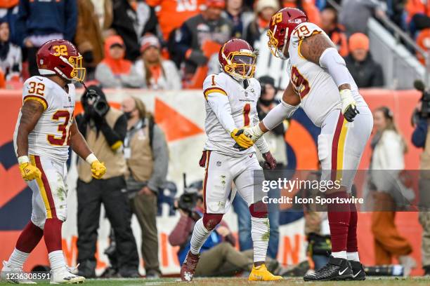 Washington Football Team wide receiver DeAndre Carter celebrates with guard Ereck Flowers and running back Jaret Patterson after a touchdown during a...