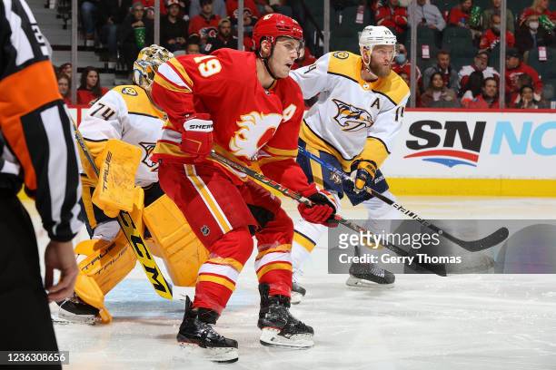 Matthew Tkachuk of the Calgary Flames battles in front of the net against the Nashville Predators at Scotiabank Saddledome on November 2, 2021 in...