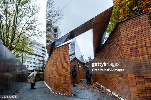 Local people visiting the Holocaust memorial. Seventy years after the Second World War, more than 102,000 victims of the Holocaust finally have their...