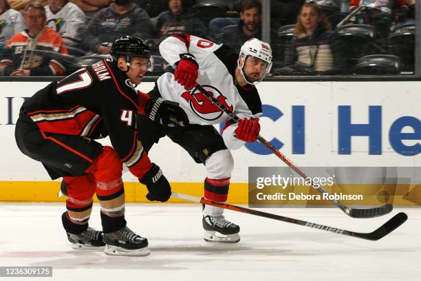 Hampus Lindholm of the Anaheim Ducks and Tomas Tatar of the New Jersey Devils battle for position during the second period at Honda Center on...