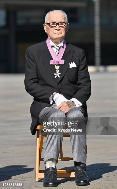 Baseball legend Shigeo Nagashima poses for a photo after receiving the Order of Culture, Japan's top cultural award, from Emperor Naruhito at the...