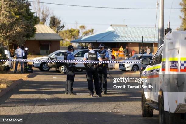 Police officers stand on patrol outside a house where four-year-old Cleo Smith was found on November 3, 2021 in Carnarvon, Australia. Cleo Smith was...