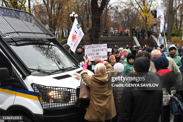 Anti-vaxxers protesters block road traffic as they stage a protest against the Covid quarantine restrictions, outside the Ukrainian parliament in...