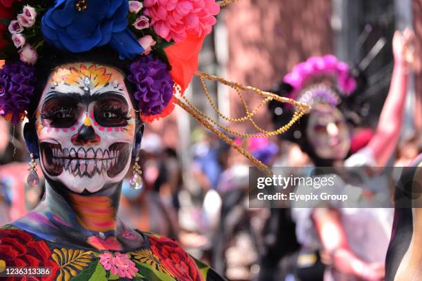 Person participates during 'Catrinas and Skulls Parade' to celebrate Mexico's Day of the Dead, participants walk from House of culture Jesus Reyes...