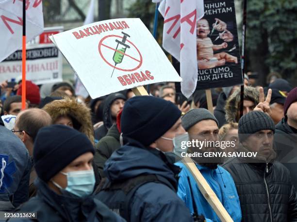 Anti-vaxxers protesters hold placard reading "Vaccination kills" during their mass protest against the Covid quarantine restrictions, outside the...