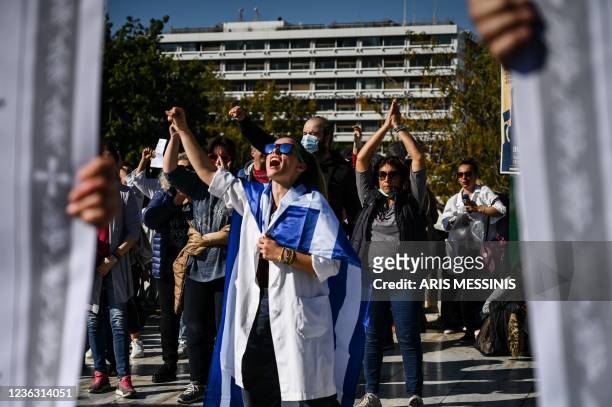 Health workers and demonstrators protest outside the Greek parliament in Athens on November 3 against Covid-19 mandatory vaccines.