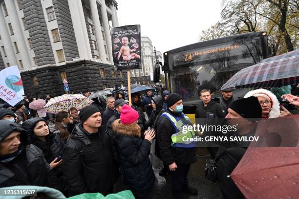 Anti-vaxxers protesters block road traffic as they stage a protest against the Covid quarantine restrictions, outside the Ukrainian parliament in...
