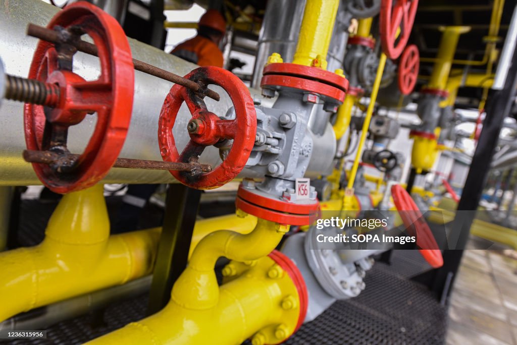 Gas pipes and valves seen at a natural gas station during...